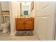 Cozy bathroom featuring tile flooring, a wood vanity with granite countertop, and plenty of storage space at 108 Pipers Ln. # 108, Myrtle Beach, SC 29575
