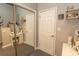 Functional bathroom with a vanity, a mirrored sliding door, and decorative shelving with personal items at 108 Pipers Ln. # 108, Myrtle Beach, SC 29575