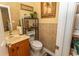 Cozy powder room featuring newspaper-print wallpaper and decorative accents at 108 Pipers Ln. # 108, Myrtle Beach, SC 29575