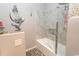 Elegant bathroom featuring marble tile, glass shower doors, and mermaid wall decor at 108 Pipers Ln. # 108, Myrtle Beach, SC 29575