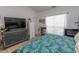 Comfortable bedroom with a dresser, TV, a large window with natural light, and wood-style flooring at 108 Pipers Ln. # 108, Myrtle Beach, SC 29575