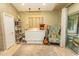 Den with neutral walls, shelving, artwork, a patterned armchair, and access to the outdoors at 108 Pipers Ln. # 108, Myrtle Beach, SC 29575
