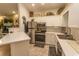 Modern kitchen with stainless steel appliances, white cabinets, and stylish backsplash at 108 Pipers Ln. # 108, Myrtle Beach, SC 29575
