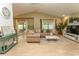 Spacious living room with vaulted ceilings, neutral tones, and natural light at 108 Pipers Ln. # 108, Myrtle Beach, SC 29575