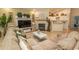 Spacious condo living space showcasing the open layout, fireplace, and kitchen at 108 Pipers Ln. # 108, Myrtle Beach, SC 29575