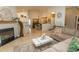 A bright, open living space with a fireplace, a kitchen and a dining area at 108 Pipers Ln. # 108, Myrtle Beach, SC 29575