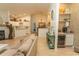 Open-concept layout featuring a living area, dining space, and a wet bar creating an inviting atmosphere at 108 Pipers Ln. # 108, Myrtle Beach, SC 29575