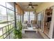 Sunroom featuring daybeds, hanging plants, coffee table and serene views at 108 Pipers Ln. # 108, Myrtle Beach, SC 29575