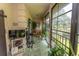 Bright sunroom featuring sliding glass windows, tiled floor and relaxing views at 108 Pipers Ln. # 108, Myrtle Beach, SC 29575
