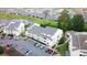 Aerial view of a community with a building, parking lot, landscaping, water features, and other houses at 1100 Possum Trot Dr. # D106, North Myrtle Beach, SC 29582