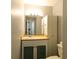 Functional bathroom with vanity, storage cabinet, mirror and toilet at 1100 Possum Trot Dr. # D106, North Myrtle Beach, SC 29582