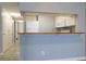 Efficient kitchen with white appliances and a convenient bar area to the living room at 1100 Possum Trot Dr. # D106, North Myrtle Beach, SC 29582