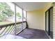 Enclosed porch area with a table, screens, siding, and a sliding door to the interior at 1100 Possum Trot Dr. # D106, North Myrtle Beach, SC 29582