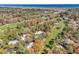Picturesque aerial view of property bordering a lush golf course and distant ocean waters at 110-1 Whitetail Way # 1, Pawleys Island, SC 29585