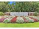 Welcoming entrance sign to Pawleys Plantation Golf and Country Club, framed by vibrant flowerbeds at 110-1 Whitetail Way # 1, Pawleys Island, SC 29585