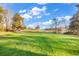 Scenic view of a sprawling golf course with manicured green grass and tranquil pond at 110-1 Whitetail Way # 1, Pawleys Island, SC 29585