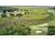 Scenic golf course with marshland, winding streams, and sand traps visible from above at 110-1 Whitetail Way # 1, Pawleys Island, SC 29585