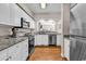 A modern kitchen showcasing sleek stainless steel appliances and elegant granite countertops at 110-1 Whitetail Way # 1, Pawleys Island, SC 29585