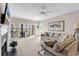 Spacious living room filled with natural light, featuring comfortable seating and access to an outdoor patio at 110-1 Whitetail Way # 1, Pawleys Island, SC 29585