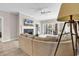 Inviting living room with a cozy fireplace and sliding glass doors leading to the outdoors at 110-1 Whitetail Way # 1, Pawleys Island, SC 29585