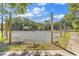 Outdoor tennis court surrounded by lush trees and blue skies at 110-1 Whitetail Way # 1, Pawleys Island, SC 29585