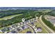Aerial view of the community showcasing the surrounding lush greenery and a nearby lake at 1102 Boswell Ct., Conway, SC 29526