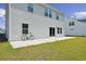 Exterior back elevation features a concrete patio and a well-manicured lawn at 1102 Boswell Ct., Conway, SC 29526