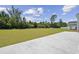 Green backyard with mature trees and concrete patio space at 1102 Boswell Ct., Conway, SC 29526