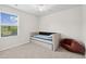 Bright bedroom features a twin-sized daybed, ceiling fan, and window at 1102 Boswell Ct., Conway, SC 29526