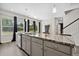 Bright kitchen features a large island with granite countertops and stainless steel appliances at 1102 Boswell Ct., Conway, SC 29526