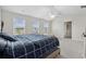 Bright main bedroom with ceiling fan, multiple windows and walk-in closet access at 1102 Boswell Ct., Conway, SC 29526