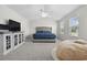 Spacious main bedroom with a large bed, ceiling fan, and abundant natural light at 1102 Boswell Ct., Conway, SC 29526
