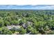 Aerial view of residential area surrounded by lush forest and a glimpse of the ocean at 1221 Tidewater Dr. # 122, North Myrtle Beach, SC 29582