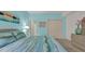 Bedroom with light blue walls, carpet flooring, and beach themed decor at 1221 Tidewater Dr. # 122, North Myrtle Beach, SC 29582