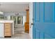 Bright entryway showcases an open floor plan with a view into the living area and outdoor balcony at 1221 Tidewater Dr. # 122, North Myrtle Beach, SC 29582