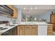 Efficient kitchen layout with appliances, cabinetry, and an open view into the living area at 1221 Tidewater Dr. # 122, North Myrtle Beach, SC 29582