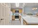 Functional kitchen features neutral countertops, appliances, and tile flooring at 1221 Tidewater Dr. # 122, North Myrtle Beach, SC 29582