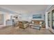 Open-concept living room with comfortable seating and seamless flow to dining and kitchen areas at 1221 Tidewater Dr. # 122, North Myrtle Beach, SC 29582