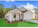 Charming single-story home with attached garage, manicured lawn, and fresh landscaping for enhanced curb appeal at 1230 Willow Oaks Way, Conway, SC 29526