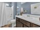Well-lit bathroom featuring a tub-shower combo and a vanity with a solid surface countertop at 1352 Jolly Roger Dr., North Myrtle Beach, SC 29582