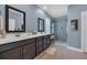 Well-appointed bathroom with double vanity, framed mirrors and a modern glass-enclosed shower at 1352 Jolly Roger Dr., North Myrtle Beach, SC 29582