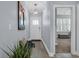 Bright foyer featuring a wooden bench, decorative lighting and view into the living room at 1352 Jolly Roger Dr., North Myrtle Beach, SC 29582