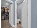 Hallway with doorway views of a walk-in closet and a powder room at 1352 Jolly Roger Dr., North Myrtle Beach, SC 29582