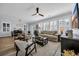 Bright living room featuring a comfortable sofa, stylish armchairs, and plenty of natural light streaming through the windows at 1352 Jolly Roger Dr., North Myrtle Beach, SC 29582