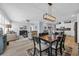 This is a living room with a dining room table, brown chairs, and an open concept kitchen at 1352 Jolly Roger Dr., North Myrtle Beach, SC 29582
