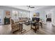 This living room features a cream couch, patterned chairs, wood floors, and a tv at 1352 Jolly Roger Dr., North Myrtle Beach, SC 29582
