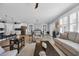 Open-concept living space with modern furnishings, a cozy seating area, and seamless flow into the dining and kitchen areas at 1352 Jolly Roger Dr., North Myrtle Beach, SC 29582