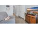 This room features a gray chair, gray walls, a tv, and a pineapple decoration on the wall at 1352 Jolly Roger Dr., North Myrtle Beach, SC 29582