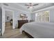 Bright main bedroom featuring a comfortable bed, wooden dresser, and abundant natural light at 1352 Jolly Roger Dr., North Myrtle Beach, SC 29582