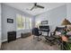 Comfortable office space with a ceiling fan, plantation shutters, and a comfortable seating area at 1352 Jolly Roger Dr., North Myrtle Beach, SC 29582